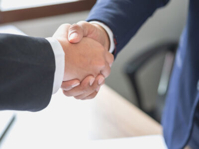 shaking hands over the sale of a business