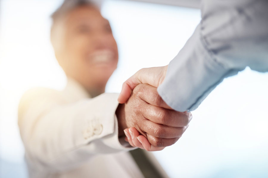 Handshake deal of a business sold to a competitor