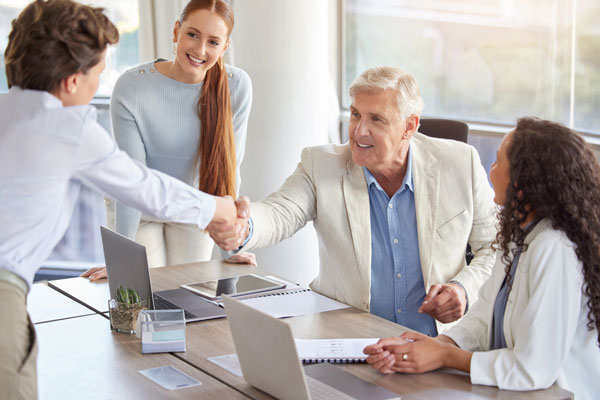 Business owner shaking hand over the sale of a family business
