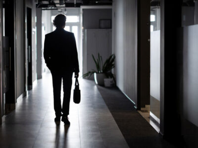 Business owner walking out of business