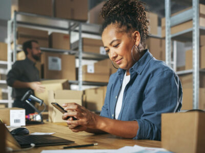 Business owner working alongside employees